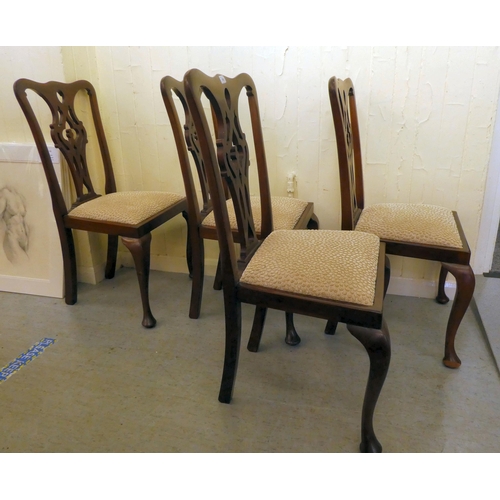 199 - A set of four early 20thC Chippendale design mahogany framed dining chairs with later fabric upholst... 