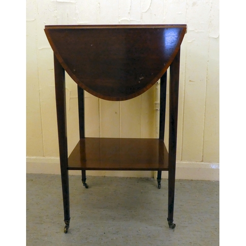 201 - An Edwardian mahogany drop leaf, two tier occasional table, raised on square legs and casters  ... 