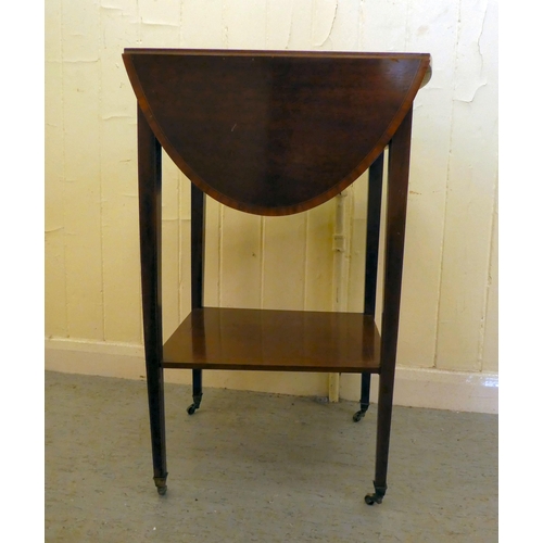 201 - An Edwardian mahogany drop leaf, two tier occasional table, raised on square legs and casters  ... 