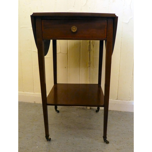 201 - An Edwardian mahogany drop leaf, two tier occasional table, raised on square legs and casters  ... 