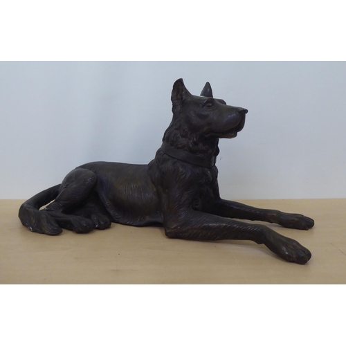 202 - A 20thC cast bronze model, a recumbent hound  11