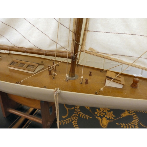 206 - A 20thC scratch built pond yacht, on a stand  46