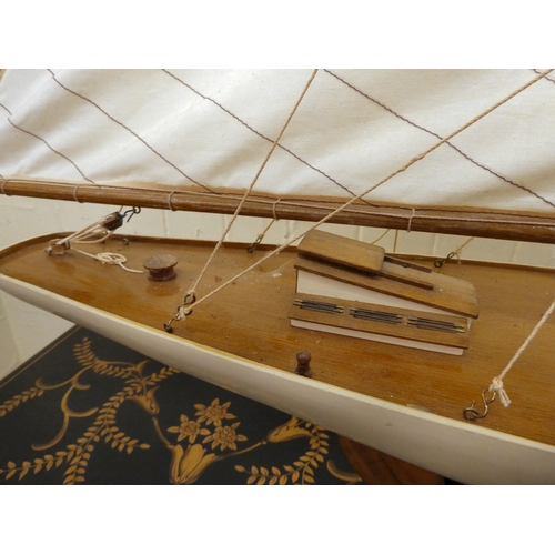 206 - A 20thC scratch built pond yacht, on a stand  46