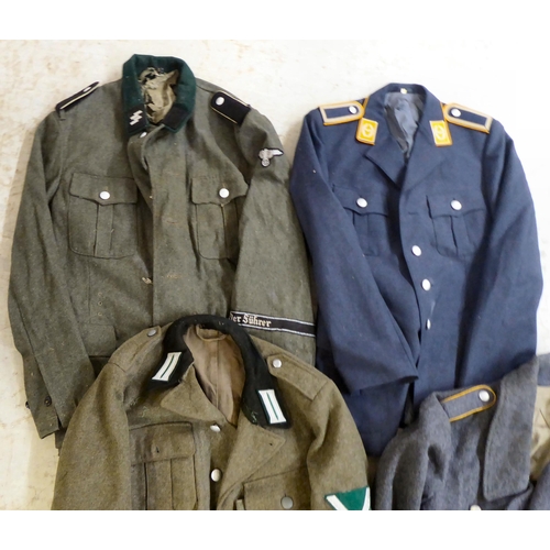 262 - Military uniforms, some copies: to include a German SS jacket(Please Note: this lot is subject to th... 