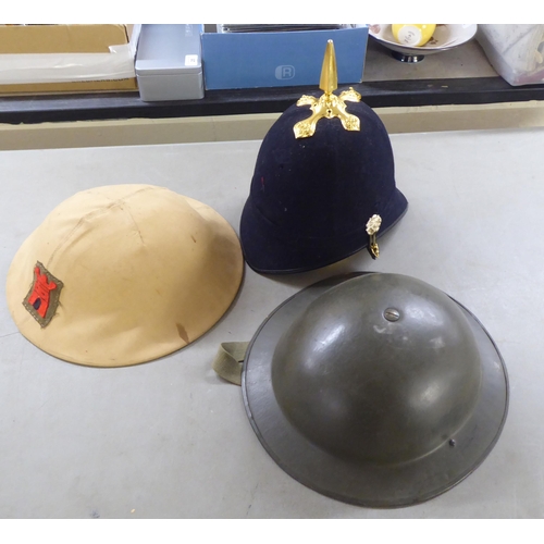 266 - Military hats and caps, mostly replicas: to include a tin helmet(Please Note: this lot is subject to... 