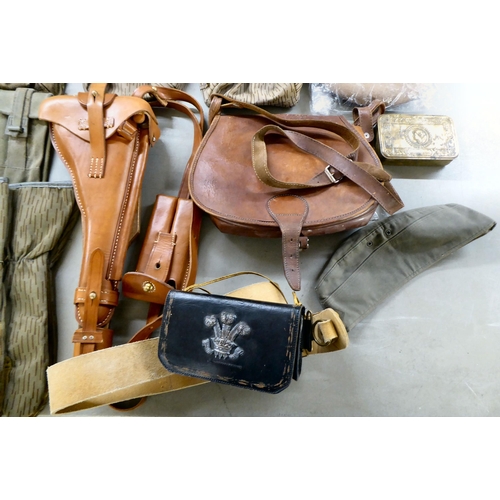 267 - Military collectables: to include a stitched brown hide holster(Please Note: this lot is subject to ... 