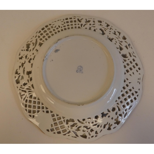 279 - A Continental porcelain plate with pierced lacework style and floral border, decorated with birds&nb... 