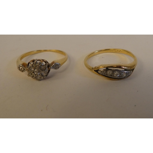 289 - Two yellow metal rings, set with white stones