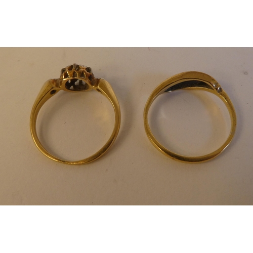 289 - Two yellow metal rings, set with white stones