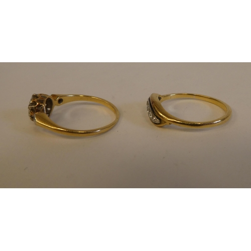 289 - Two yellow metal rings, set with white stones