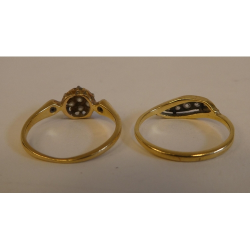 289 - Two yellow metal rings, set with white stones