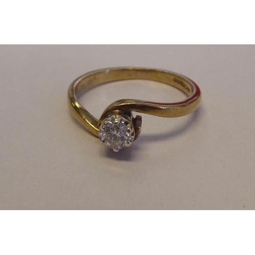 295 - A 14ct gold, crossover set, single stone diamond ring