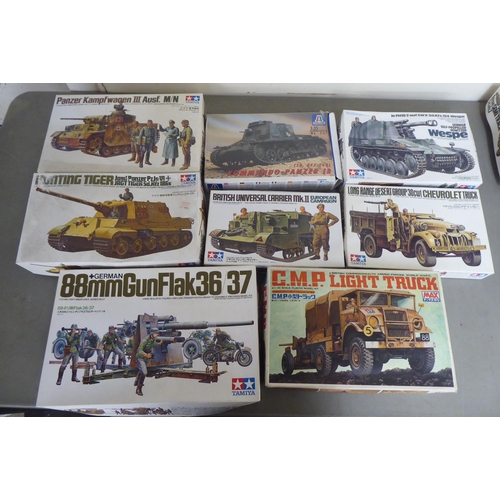 307 - 1/35 scale model kits: to include by Tamiya, a 'British Universal Carrier Mk.II'; and a 'Kangaroo Pe... 