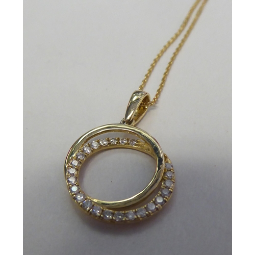 315 - A 9ct gold, diamond set, halo style necklace, on a fine neckchain