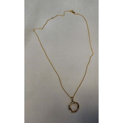 315 - A 9ct gold, diamond set, halo style necklace, on a fine neckchain