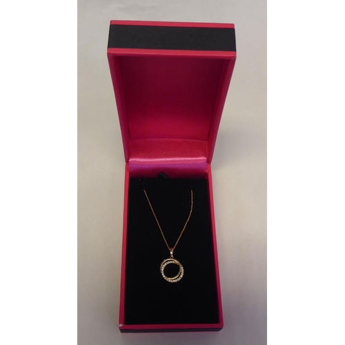 315 - A 9ct gold, diamond set, halo style necklace, on a fine neckchain