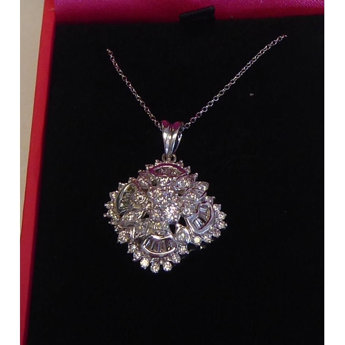 320 - A 14ct white gold and diamond set pendant, on a fine neckchain