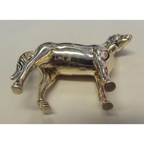 324 - A silver coloured metal novelty pin cushion, fashioned as a standing pony