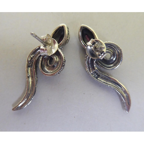 327 - A pair of silver coloured metal and marcasite snake earrings