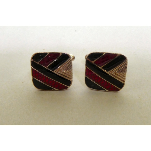 333 - A pair of silver coloured metal and coloured enamel, folding bar cufflinks