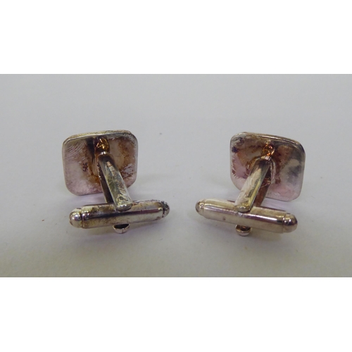 333 - A pair of silver coloured metal and coloured enamel, folding bar cufflinks