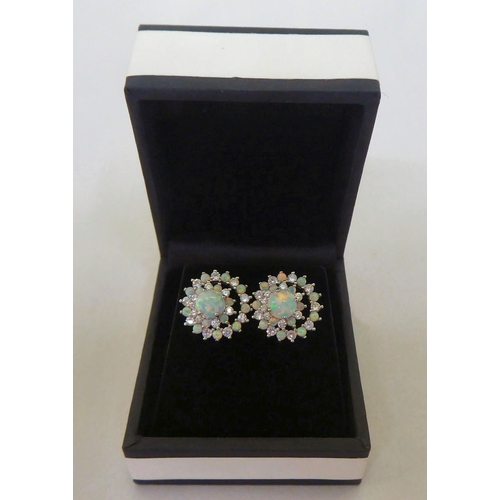 337 - A pair of silver coloured metal, cubic zirconia and opal set earrings