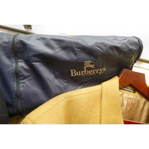 354 - Gentlemans fashion: to include two Burberry jackets, one in tan, the other navy  approx. size 48/XXL... 