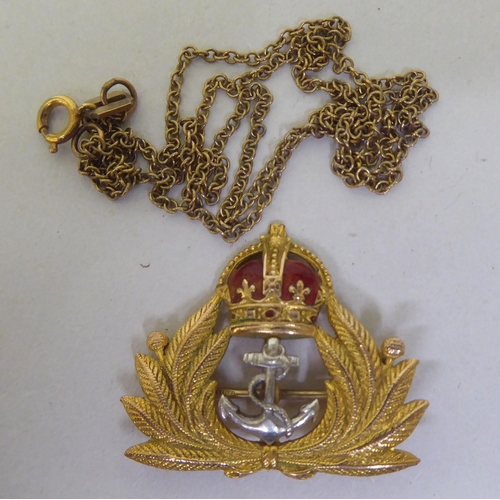 361 - A 9ct gold naval themed brooch; and a fine 9ct gold chain 