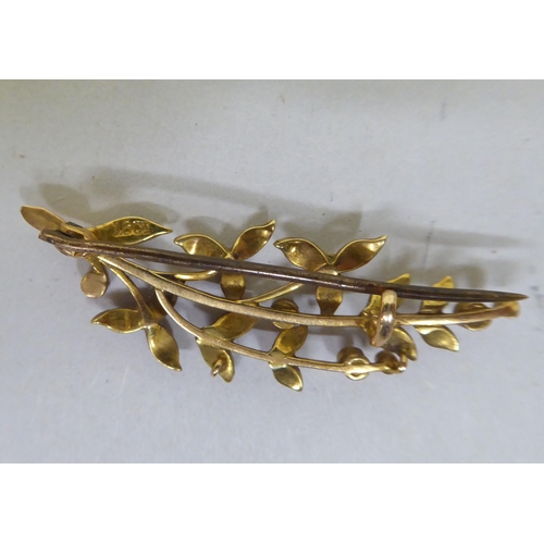 365 - A 9ct gold scarf pin; and a 15ct gold brooch, set with pearls, fashioned as a branch