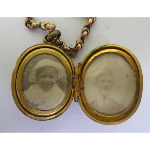 370 - A yellow metal locket, on a yellow metal chain 