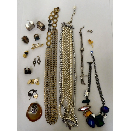 389 - Costume jewellery: to include a necklace, set with eight coloured faux precious stones 