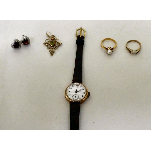 390 - Items of personal ornament: to include a 9ct gold cased, vintage wristwatch, faced by an Arabic dial... 