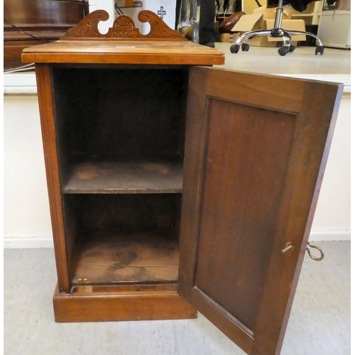 398 - A late Victorian walnut pot cupboard with a door, on a plinth  29