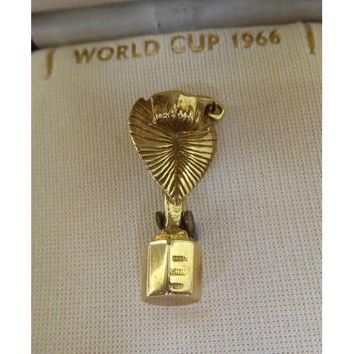 406 - A 9ct gold charm, fashioned as the 1966 World Cup  boxed 