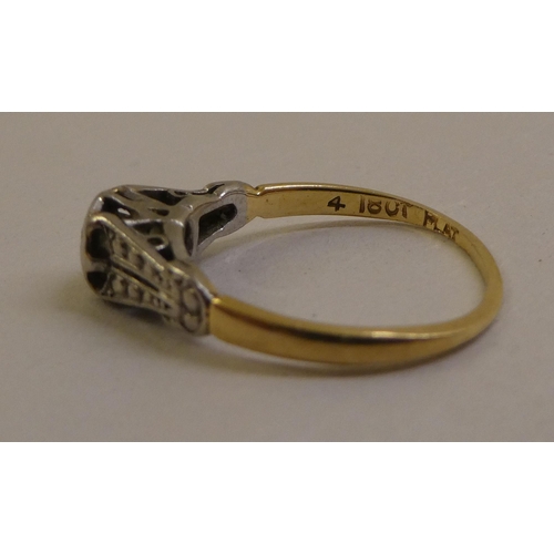 57 - An 18ct gold and platinum diamond solitaire ring