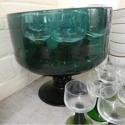 62 - Glassware: to include a green glass pedestal punch bowl with six pedestal glasses