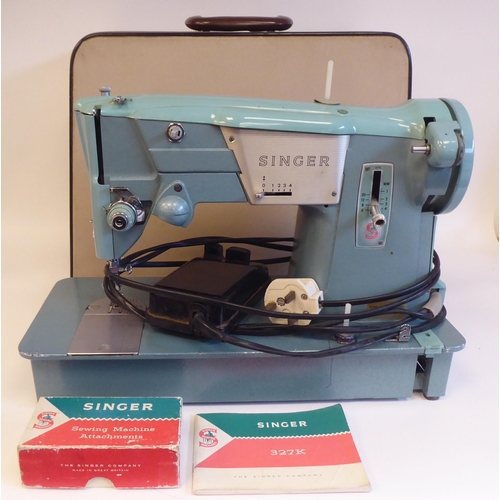 96 - A Singer electric sewing machine, in a carrying case