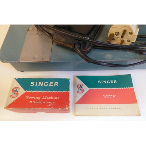 96 - A Singer electric sewing machine, in a carrying case