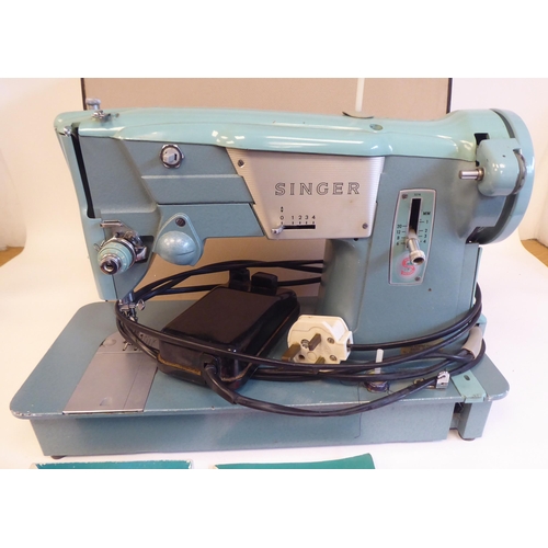 96 - A Singer electric sewing machine, in a carrying case