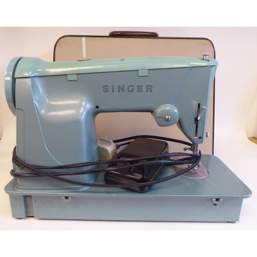 96 - A Singer electric sewing machine, in a carrying case