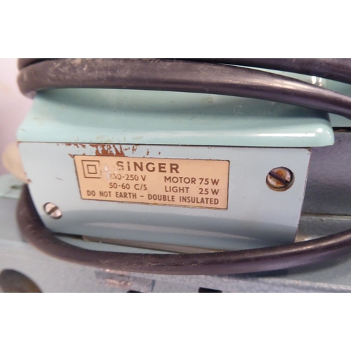 96 - A Singer electric sewing machine, in a carrying case