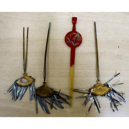 273 - 20thC Oriental hair accessories: to include pins and combs