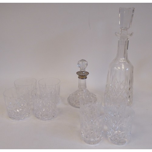 99 - Waterford Crystal Lismore pattern viz; two decanters and two sets of four tumblers