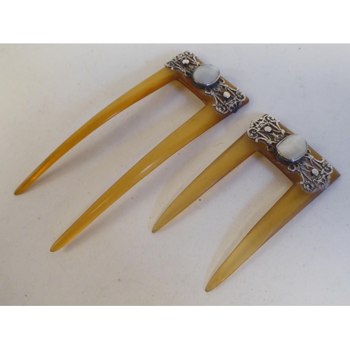 103 - Two vintage amber coloured hair grips, each set with a pearl