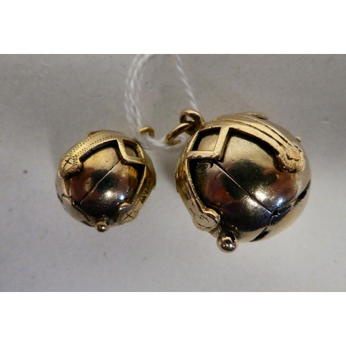 108 - Two yellow metal Masonic puzzle balls