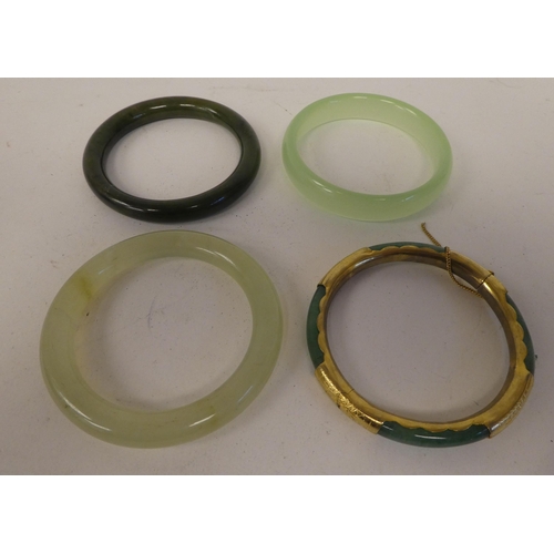 111 - Oriental and other themed items of personal ornament: to include jade coloured bangles 