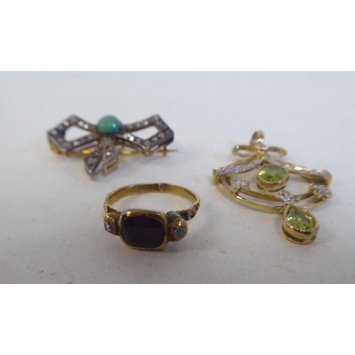 114 - Jewellery: to include a ring and two brooches set with various stones  mixed marks 