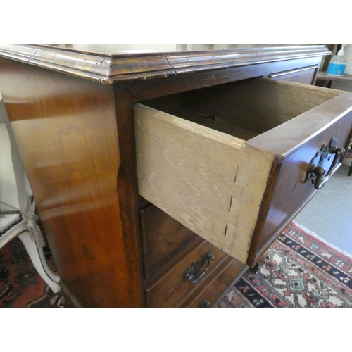 15 - A modern Georgian design mahogany and burr walnut, five drawer dressing chest, raised on bracket fee... 