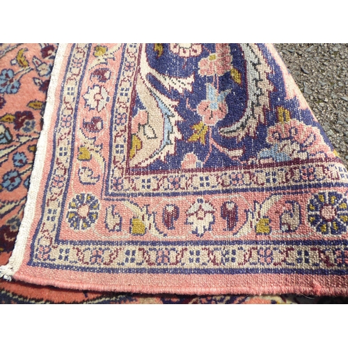 191 - A Persian Kashan runner, decorated with floral patterns, on a pink ground&nbsp; 232