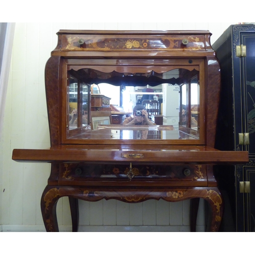 2 - A modern Louis XV design, marquetry cocktail cabinet with a drawer, over a fall front and another dr... 